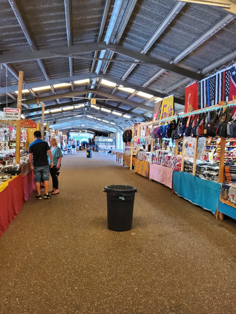 a large indoor market with a group of people
